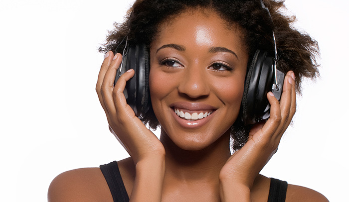 Woman listening to podcast with headphones