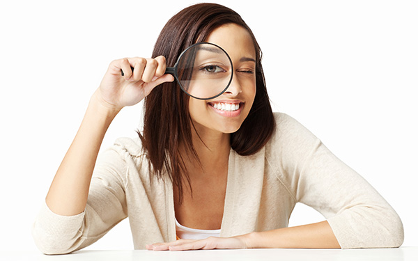 Female with magnifying glass