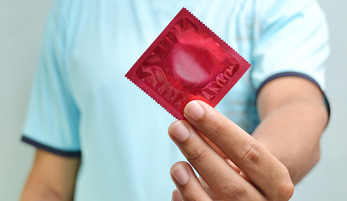 Student holding condom