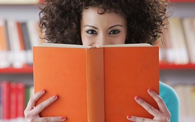 Female Student With Her Nose In A Book