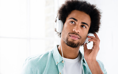 Student De-stressing By Listening To Music