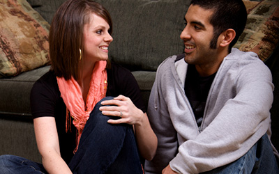 Two Friends Sitting Down And Talking