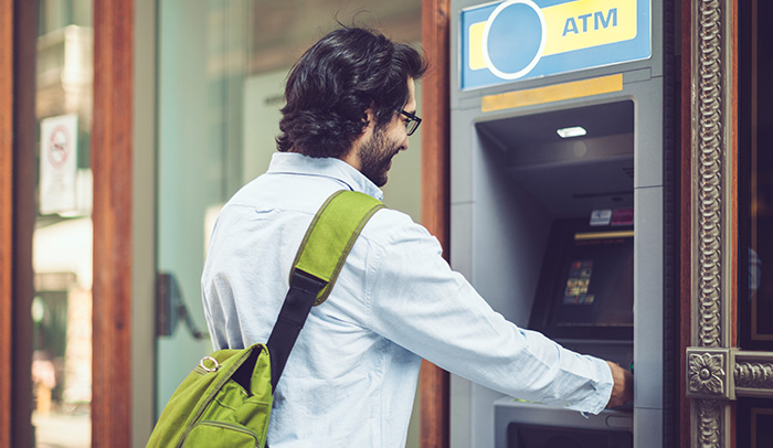 Student withdrawing money from an ATM