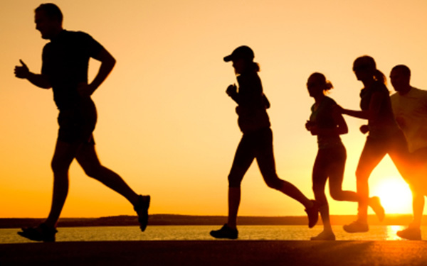 Group of students running outdoors