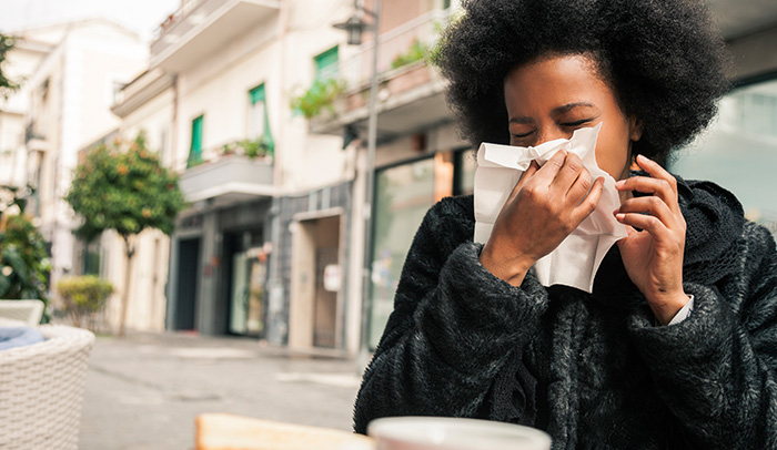 Female student blowing nose