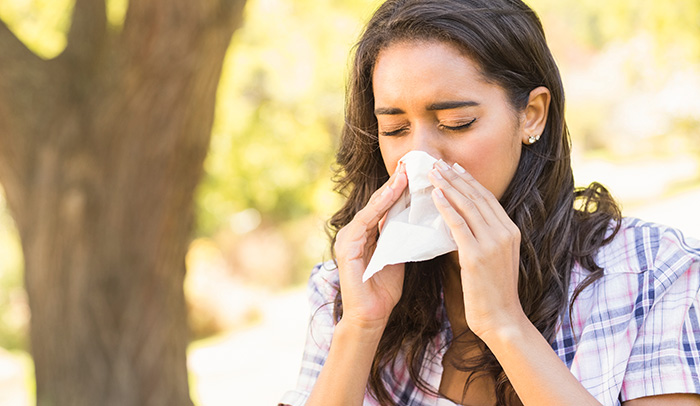 Female student blowing nose